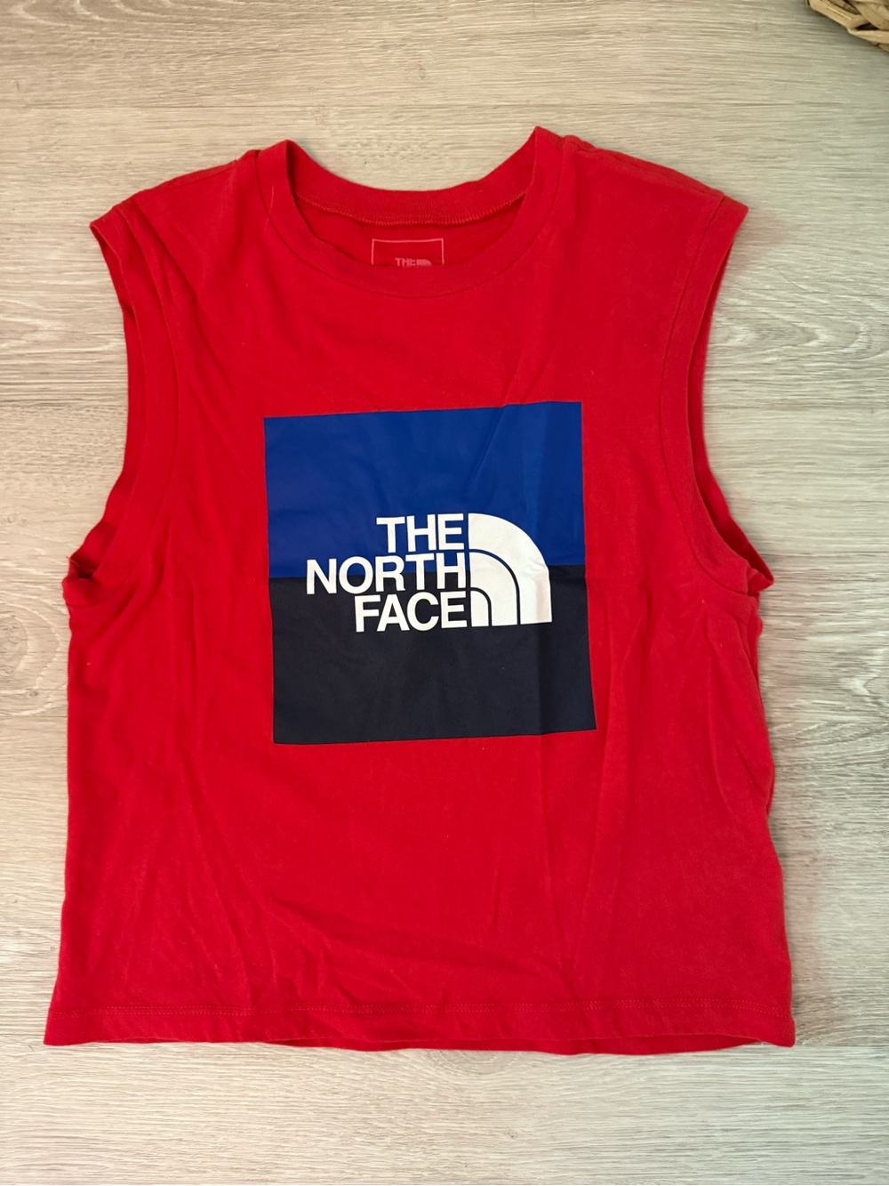 The North Face Women's Red Muscle Tank with Blue and Black Logo